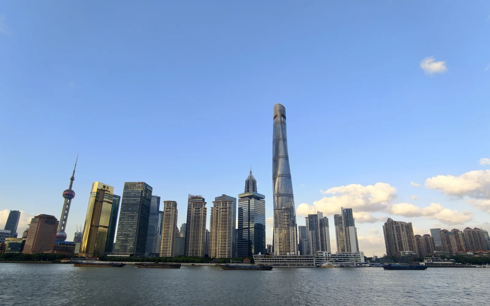 Shanghai skyline across the Huangpu River with Shanghai Tower and the Oriental Pearl Tower